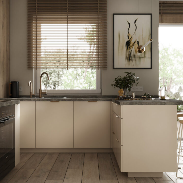 Kuchnia z wyspą – jasna zabudowa, drewniany blat i hoker w nowoczesnym wnętrzu