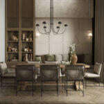 Jadalnia otwarta na ogród w Małocicach z dużym stołem i tapicerowanymi krzesłami